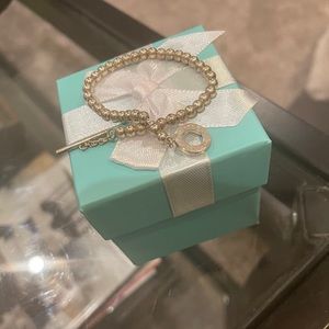 Tiffany’s sterling silver charm bracket